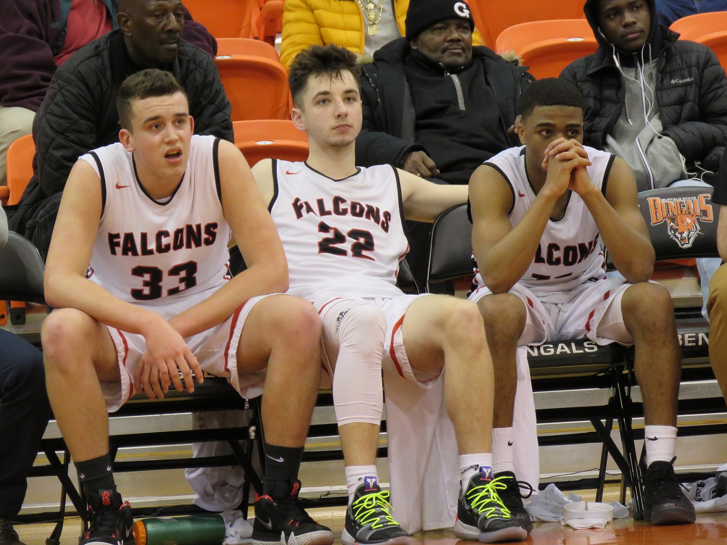 From left, seniors Cam Miller, Roman Wright and Davon Ware watch as time ticks down during the Niagara-Wheatfield Falcons' 66-43 loss in the Section VI Class A1 semifinals. (Photos by David Yarger)