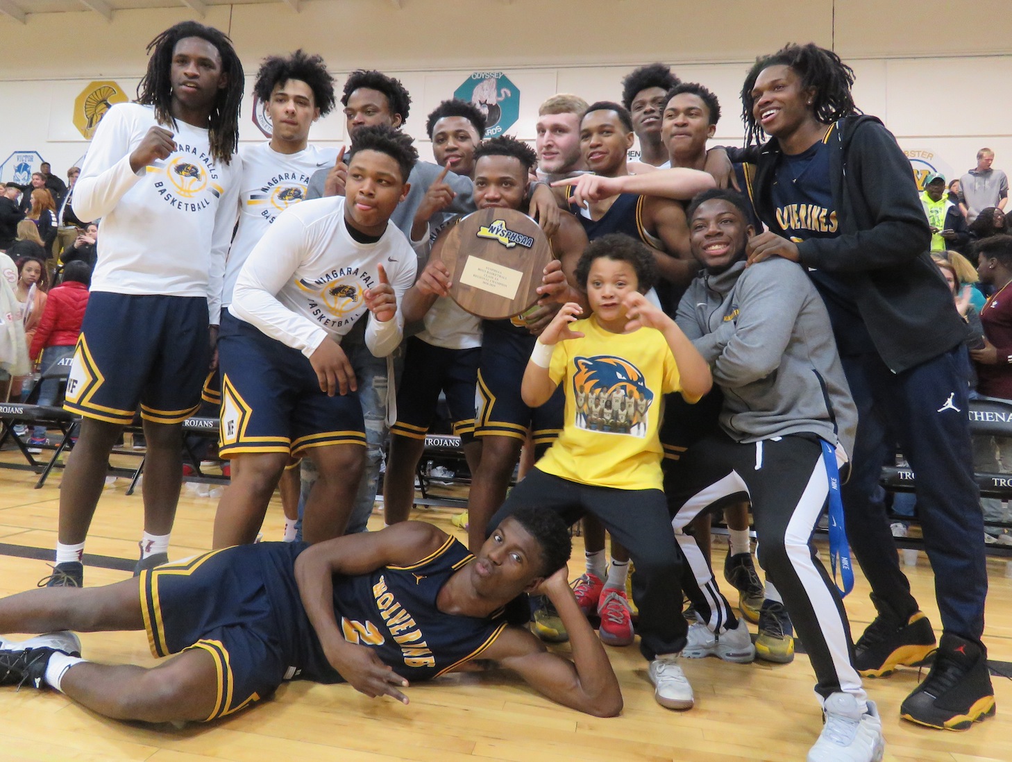 The Niagara Falls Wolverines pose following a Far West Regional victory over McQuaid. The win clinched the Wolverines' first state final four appearance in 10 years. (Photos by David Yarger)
