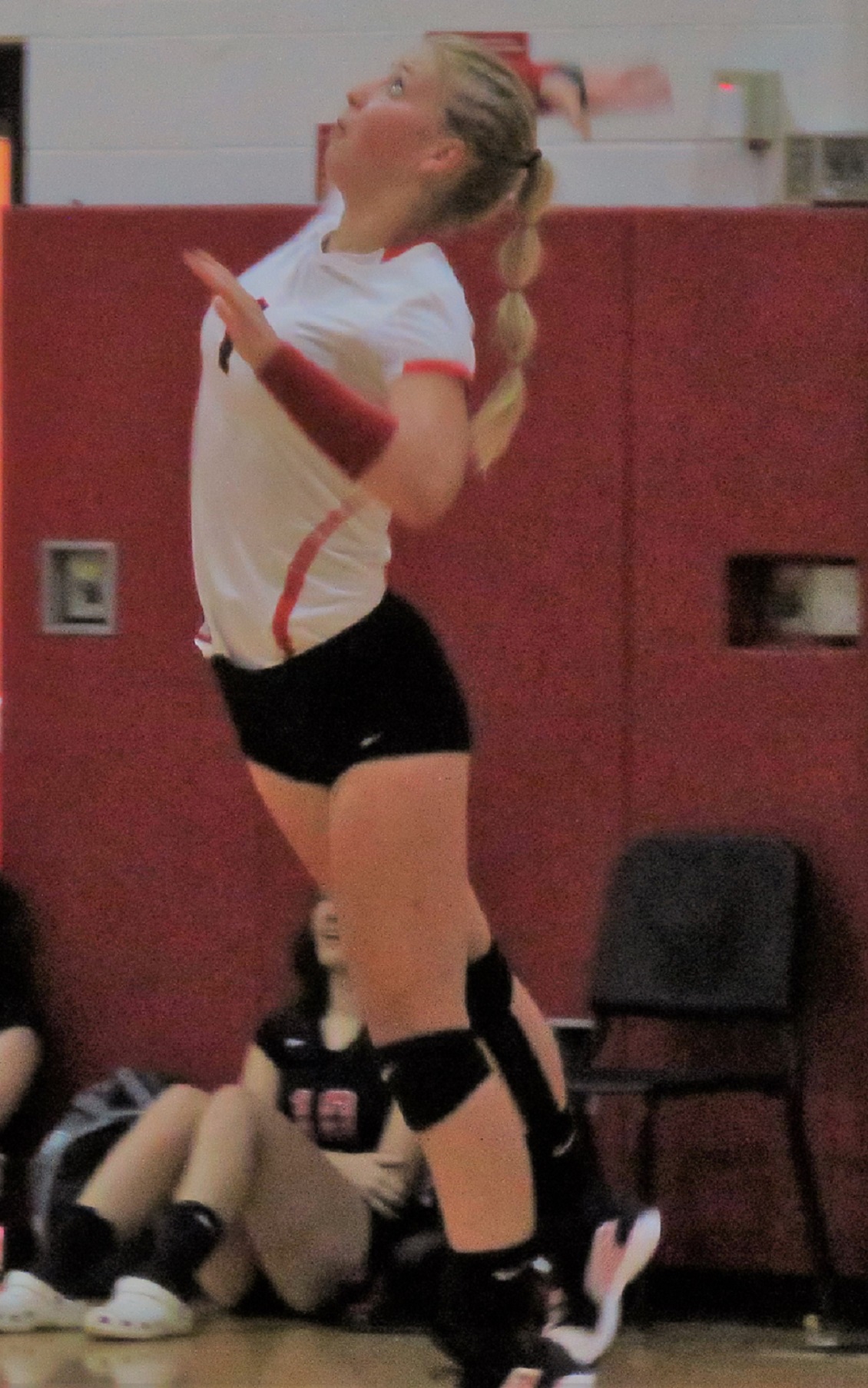 Jenna Sonnenberg serves for the Lady Falcons during Tuesday's Niagara Frontier League opener versus Lockport. The Falcons swept the Lions, 3-0. (Photo by David Yarger) 