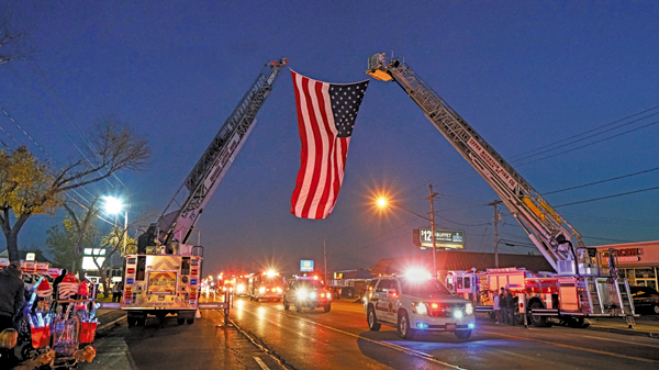 The American flag raised as the motorcade goes on during the 2016 Electric Lights Festival. (Photo by K&D Action Photo and Aerial Photography)