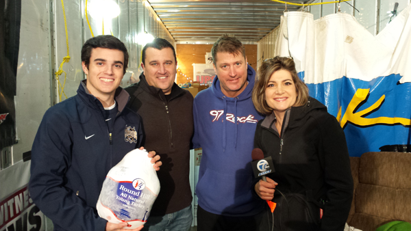 Senior Contributing Writer Michael J. Billoni took this photo in 2014. Pictured, from left, Kurt Villani Jr., Kurt P. Villani, Dave `D.J.` Jickster and former WKBW-TV Channel 7 news anchor Joanna Pasceri donate turkeys at `Rock Out Hunger` to benefit the Food Bank of WNY.