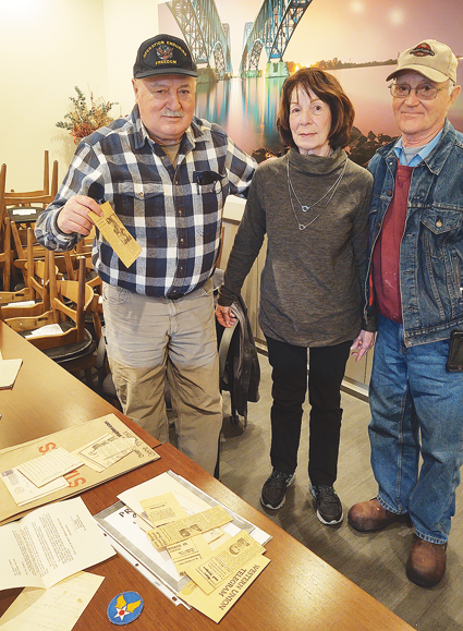 Gene Dinsmore, Diane Lapp and Ray DeGlopper with some of the information they have collected about Second Lt. Eugene F. Dinsmore.