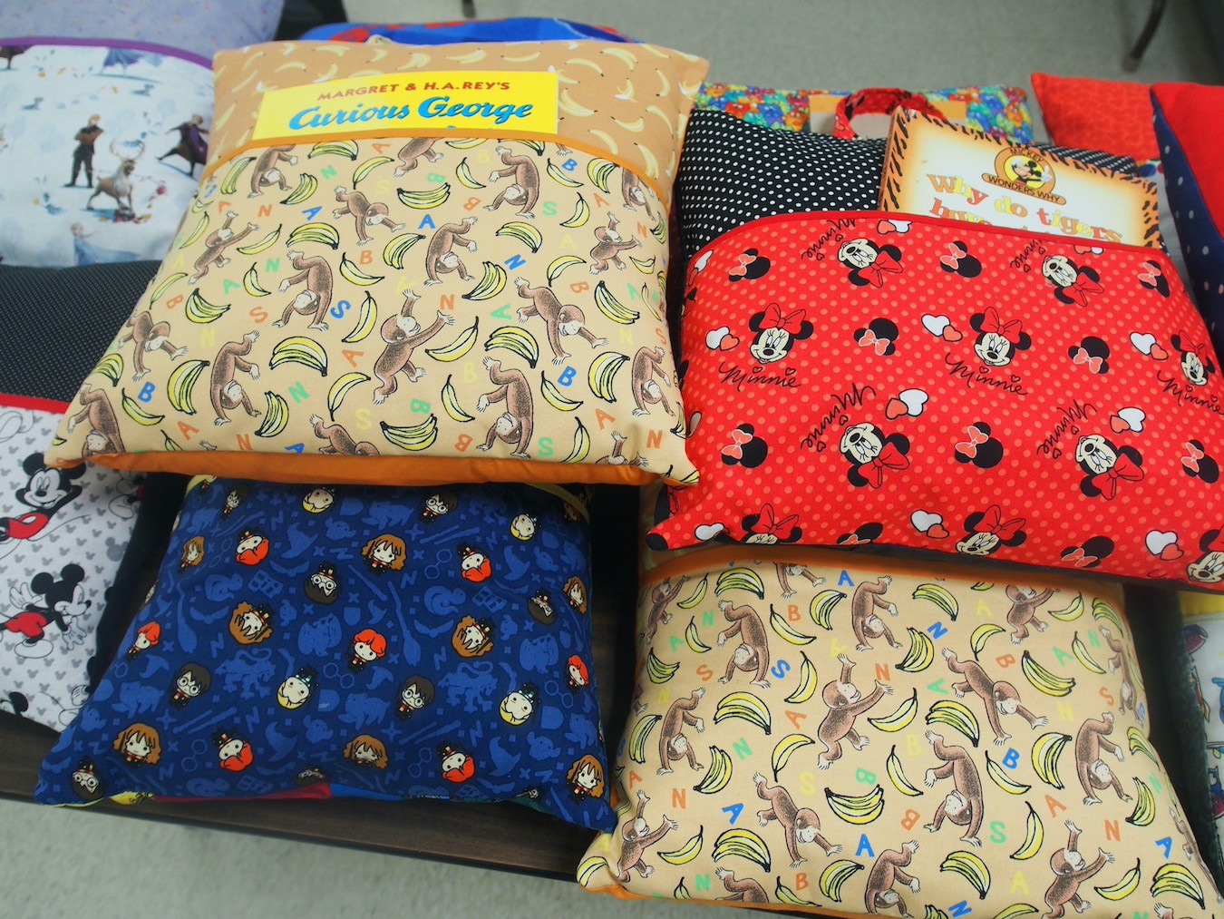 Some of the book pillows that will be given away at the April raffle at the Grand Island Memorial Library, which has children excited about reading as the goal.