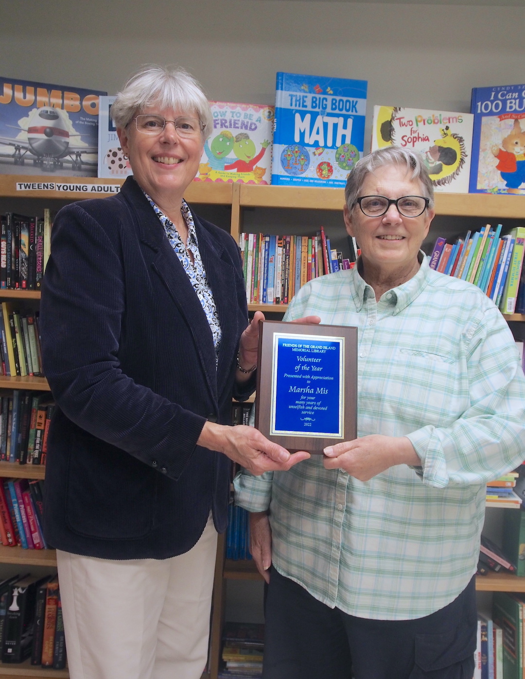 Mary Cooke, president of the Friends of the Grand Island Memorial Library, with Marsha Mis, volunteer of the year.