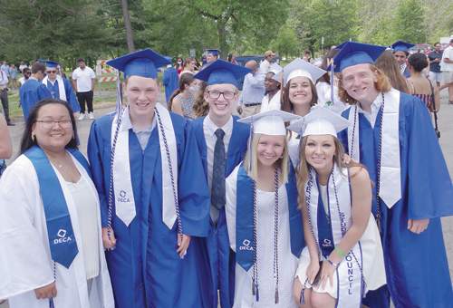 Grand Island High School graduates from the Class of 2020 are all smiles during the 55th annual commencement ceremony at Beaver Island State Park on Sunday. The ceremony included a drive-thru format. From left: Victoria Huang, Luke Hess, Matthew Aronica, Gabriella Bergstrom, Emily Reynolds, Kaylee Butcher and Benjamin Spiesz. (Photo by Larry Austin)