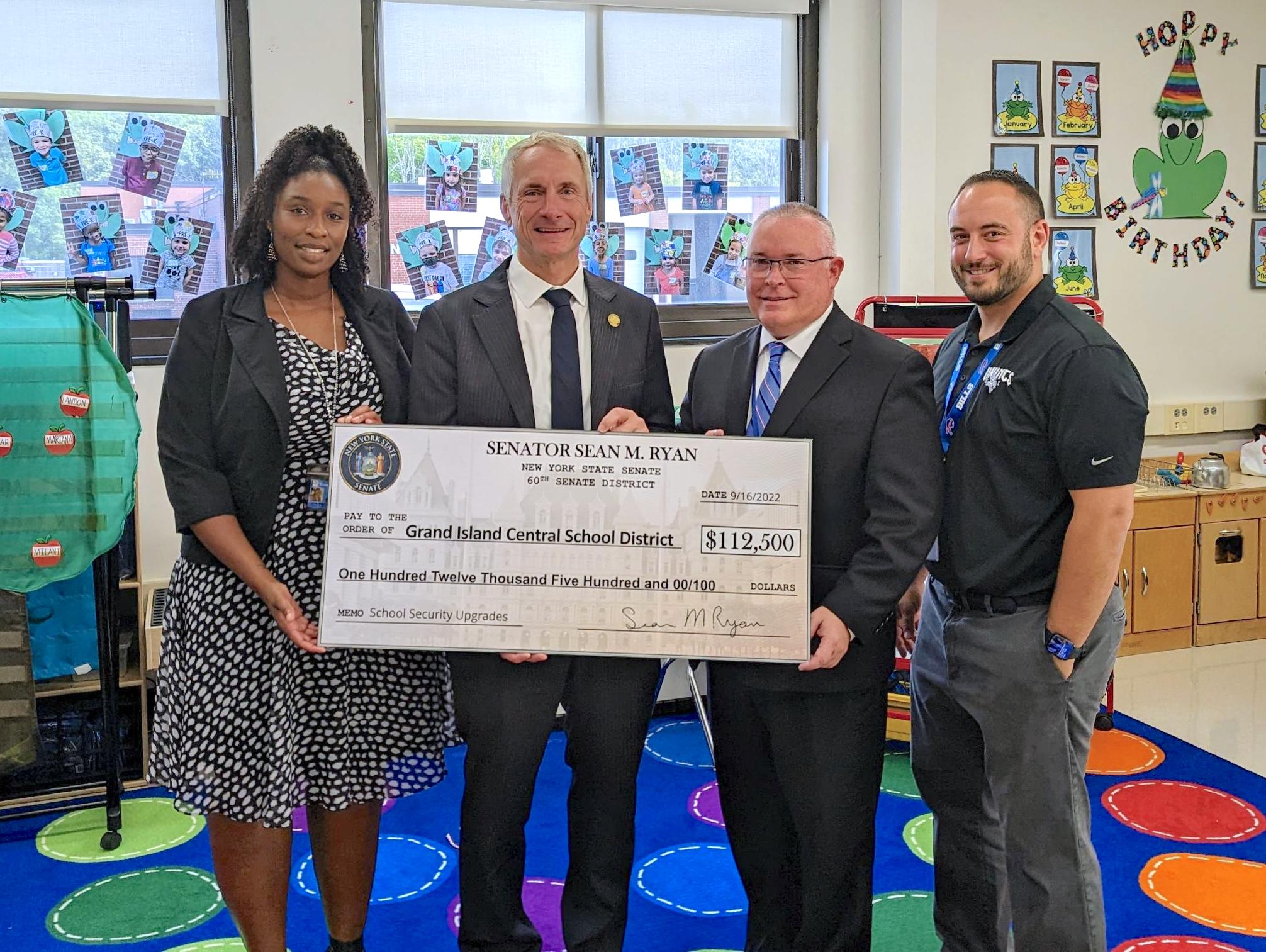 Pictured: Assistant Superintendent Rubie Harris, Sen. Sean Ryan, Superintendent Brian Graham and Principal Mike Antonelli gather at Charlotte Sidway Elementary School on Sept. 16.