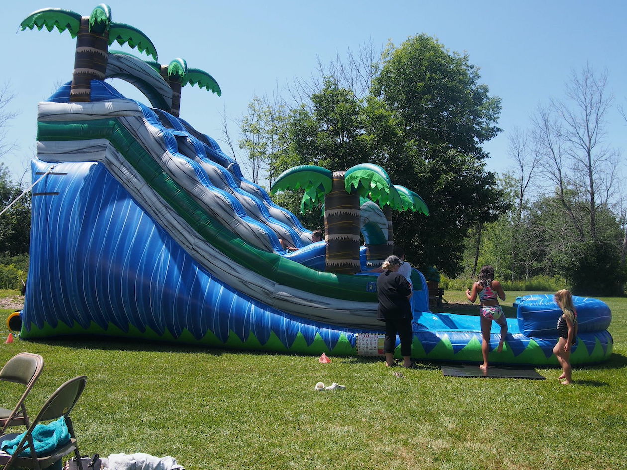 Kids are attracted to the water slide at Trinity United Methodist Church's summer breakout event.