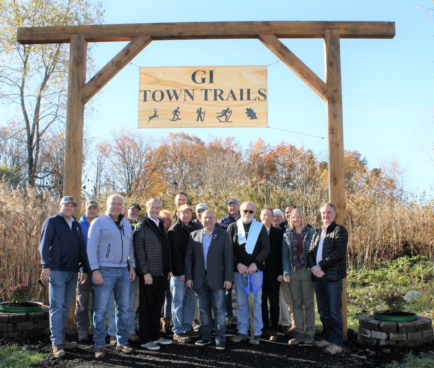 At the Nike Base Grand Island Town Trails ribbon-cutting held Nov. 21, 2021, Supervisor John Whitney (second from left) is shown with Assemblyman Angelo Morinello (center) and Niagara River Greenway Executive Director Greg Stevens. (Photo provided by the Town of Grand Island)