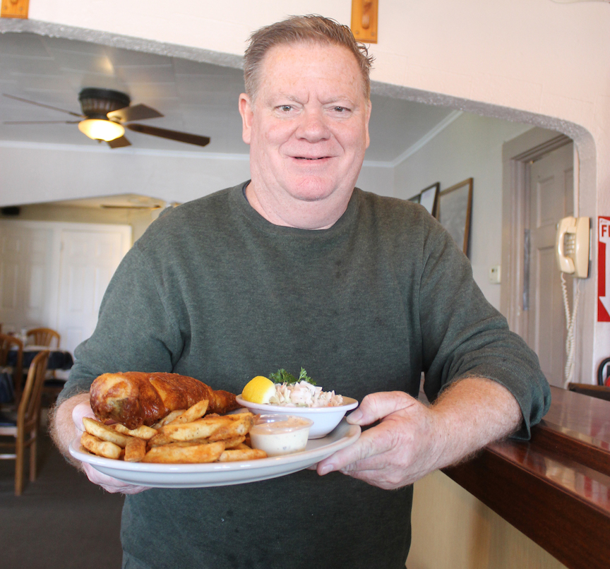 Village Inn owner Mike Carr shows off the restaurant's classic fish fry, winner of Niagara Frontier Publications' 2022 `Best Fish Fry` contest.