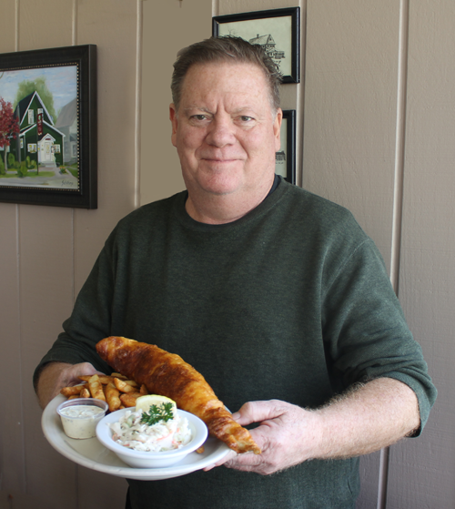 Village Inn owner Mike Carr shows off the restaurant's classic fish fry, winner of Niagara Frontier Publications' 2023 `Best Fish Fry Contest.`