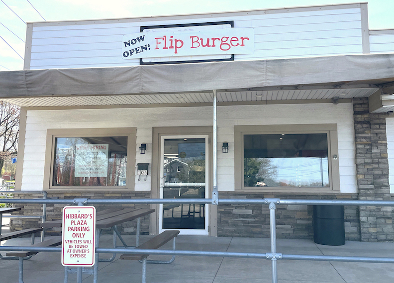 Pictured is the temporary sign atop the Lewiston Flip Burger, and (below) part of the Niagara Falls storefront.