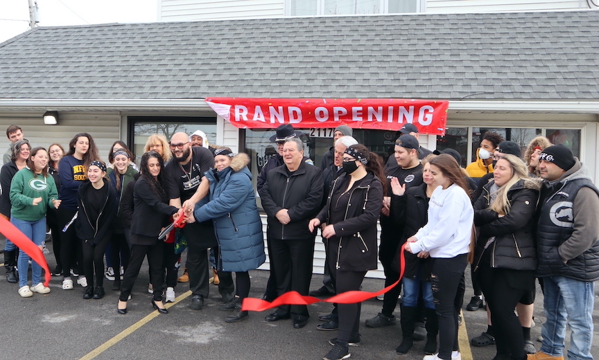 Ghada Have It! owner Bashar Srouji is joined by friends, family and local officials for the restaurant's grand reopening at its new location at 2117 Military Road, just across from the Fashion Outlet Mall.