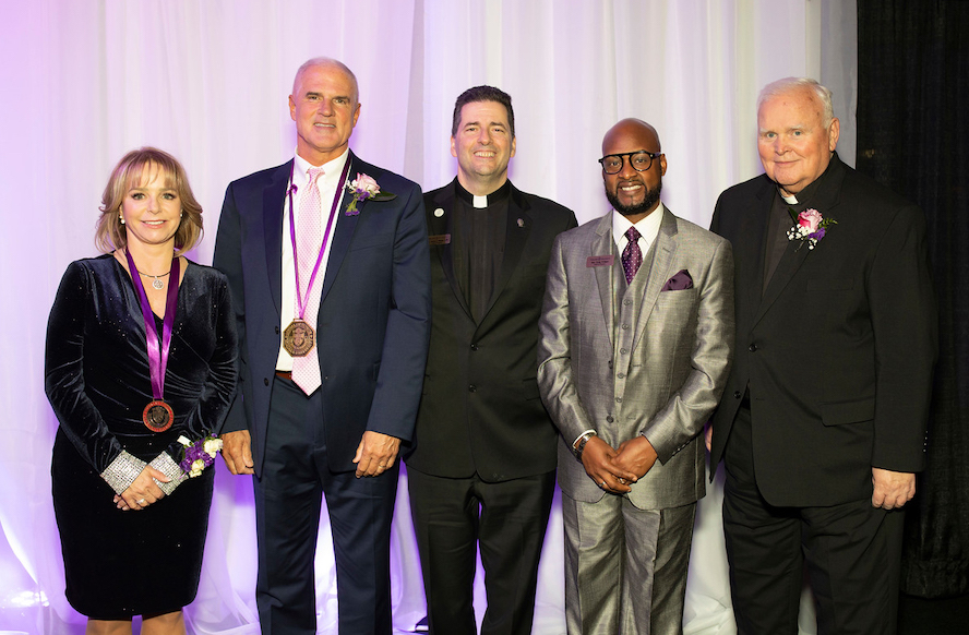 Niagara University President's Dinner honorees Laura Zaepfel (Caritas Medal), Paul E. O'Leary Jr., '81 (Medal of Honor), Rev. Craig D. Pridgen (Legacy of Service Award), and Rev. Michael J. Carroll, C.M., '73, '11 (Hon.), (St. Vincent de Paul Award) with the Rev. James J. Maher, C.M., Niagara University president (center).
