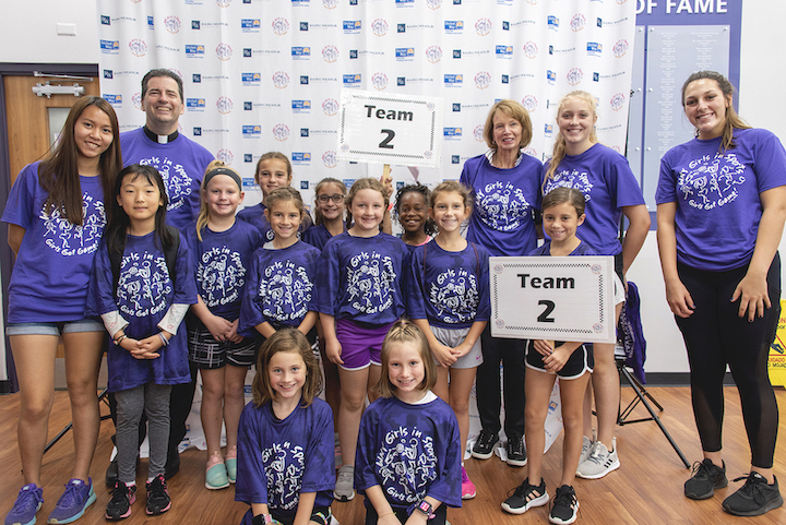 Teams of girls between the ages of 9 and 12 learned more about sports at Niagara County's first Western New York Girls in Sports Day, hosted by Niagara University. The Rev. James J. Maher, Niagara University president, and Western New York Girls in Sports founder Mary Wilson, Ralph C. Wilson, Jr. Foundation (back row, third from right), were on hand to watch the activities and offer their encouragement.