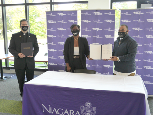 Niagara University President The Rev. James J. Maher, C.M., identifying and dismantling racial injustice task force members Kara Oliver (NU director of strategic initiatives) and junior Lovell Lee announce the university's new Fannie Lou Hamer Freedom Retention Scholarship.