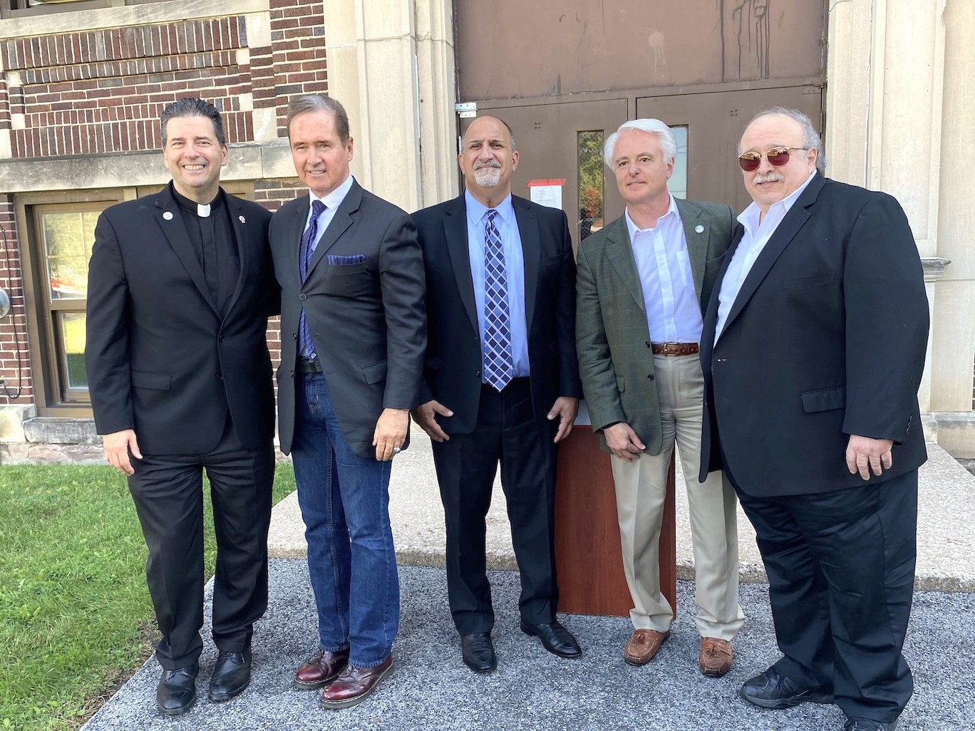 Pictured, from left, at a Thursday press conference are Niagara University President the Rev. James Maher, Congressman Brian Higgins, Niagara Falls City School District Superintendent Mark Laurrie, Mayor Robert Restaino and Russ Petrozzi. (Submitted photo)