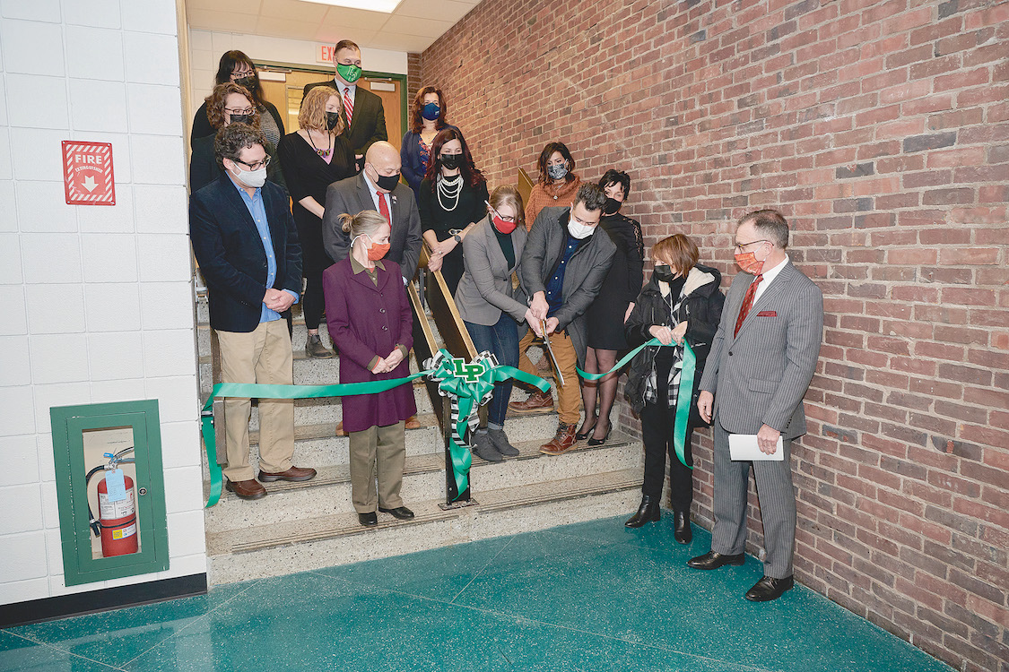 Superintendent Paul Casseri joins with district administrators, local officials and visitors as a ribbon is cut to officially open the new LEVEL gallery. (Photos by Mark Williams Jr.)