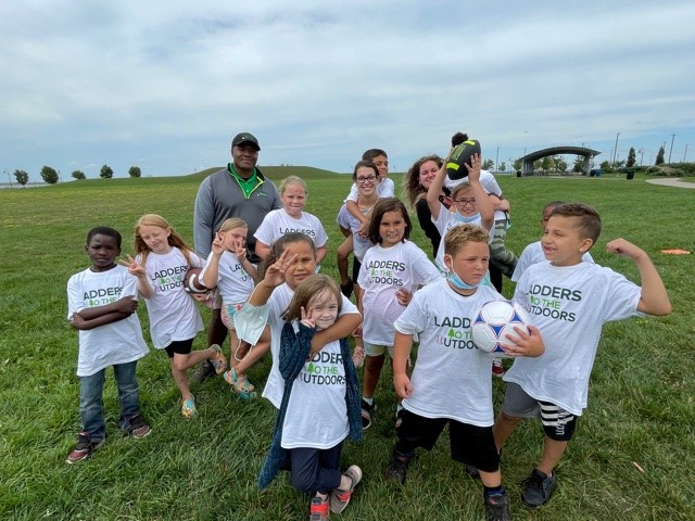 Children from the Seneca Babcock Community Center celebrated the first season of `Ladders to the Outdoors` with an `LTO Field Day` at Buffalo Harbor State Park on Sept. 1. GObike Buffalo joined in the fun with bike riding lessons and repairs. (State Parks photo)