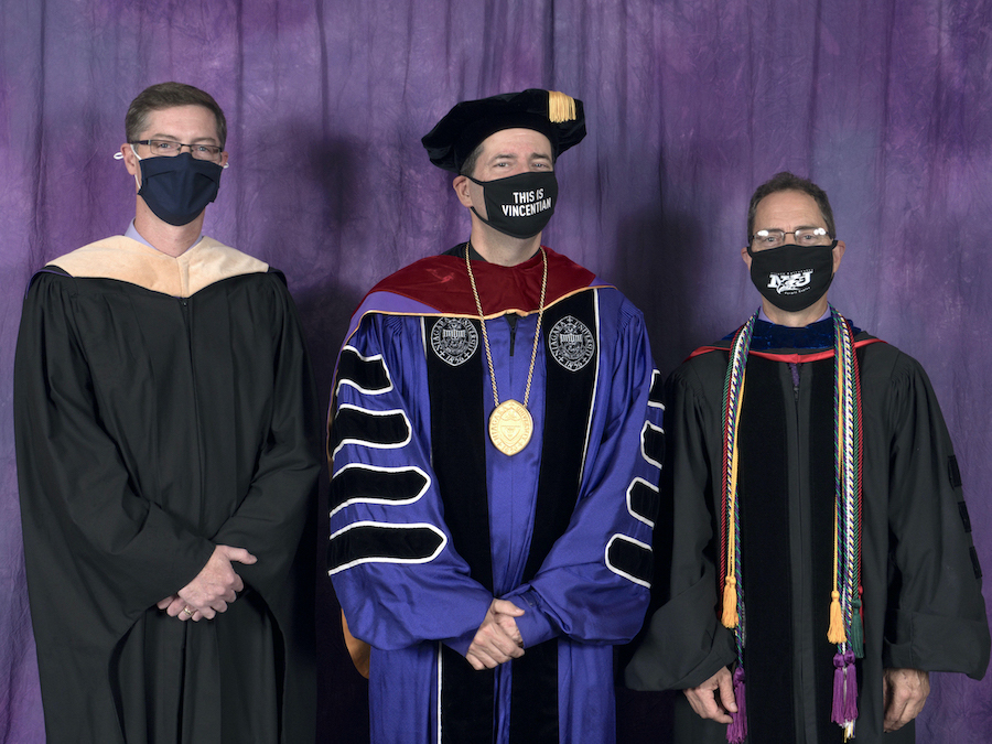 The Rev. James J. Maher, C.M., Niagara University president (center), with honorees Daniel S. McMann, NU facility planner (left), and Dr. Mark A. Gallo, professor of biology.