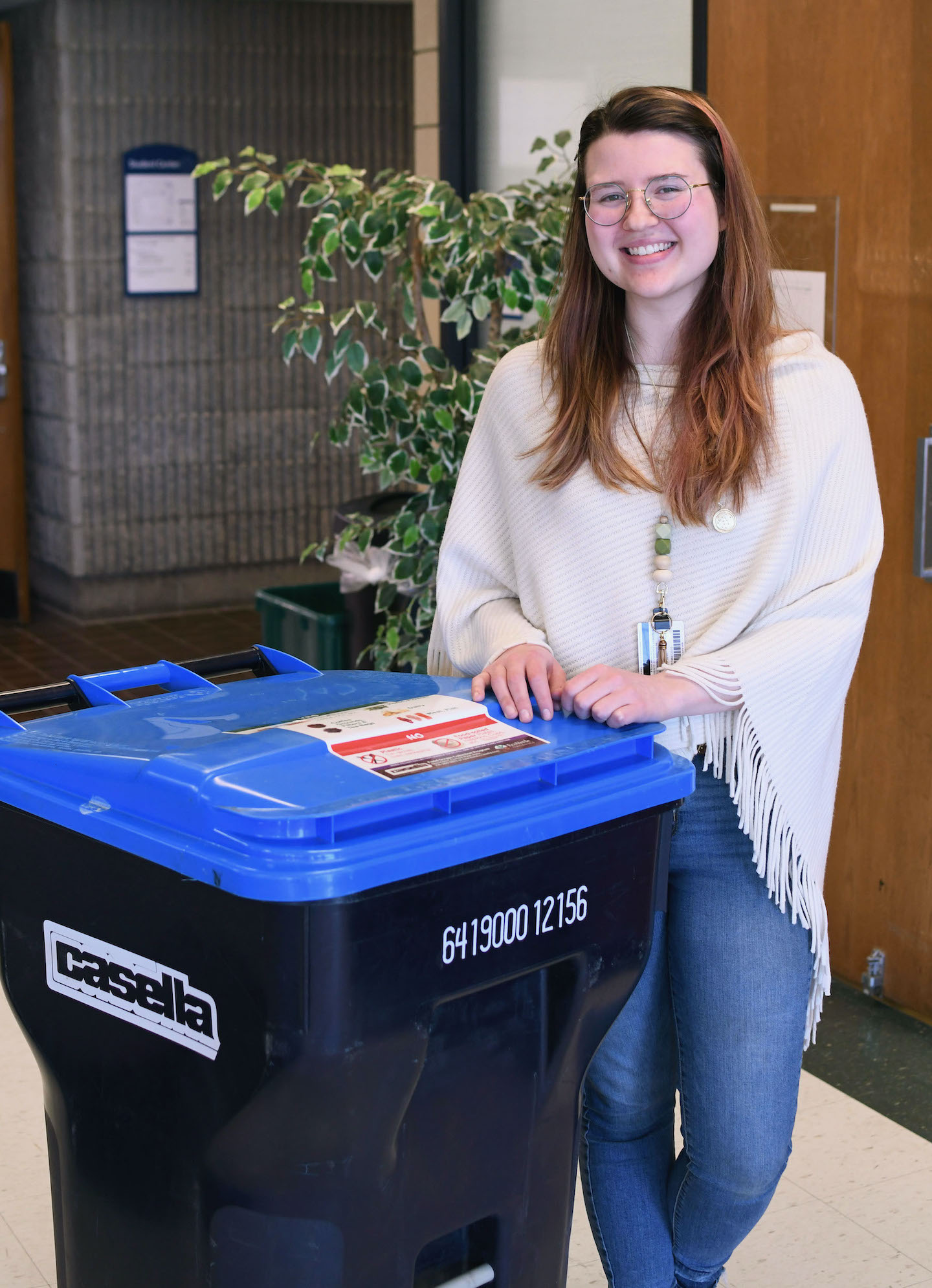 Environmental studies student and 2023 SUNY Chancellor's Award recipient Meredith Preve smiles next to NCCC's first compost bin. (Submitted)