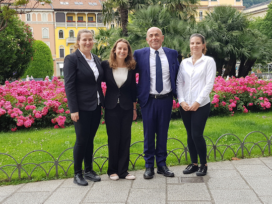 Niagara University student Amanda Brannan, second from left, is pictured with a few of her co-workers outside of the Hotel Metropole Suisse in Lake Como, Italy.