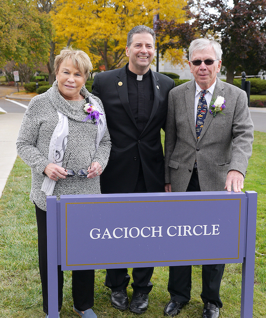 The traffic circle in the middle of the Niagara University campus was dedicated as Gacioch Circle in honor of the lifetime support of William, '61, '07 (Hon.), and Nancy Gacioch. They are pictured with the Rev. James J. Maher, C.M., Niagara University president.