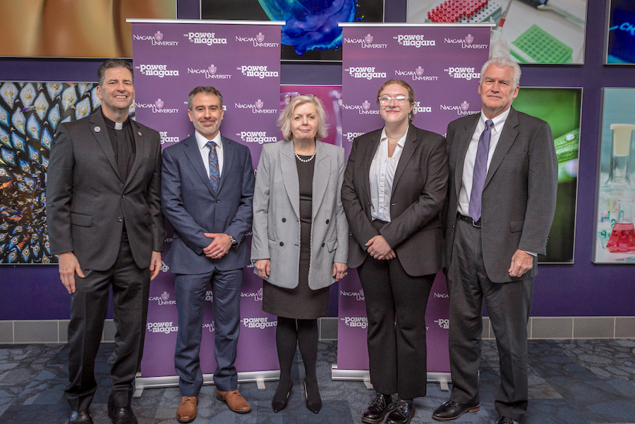 Rev. James J. Maher, C.M., Niagara University president; Dr. Kyle Mack '05, founder/CEO, Vivante Advisors; Dr. Mary McCourt, professor of chemistry; Morgan Hildreth '25, biochemistry student; and Dr. Tim Ireland, provost/VP for academic affairs, at the announcement of a $2,500,000 gift to Niagara.