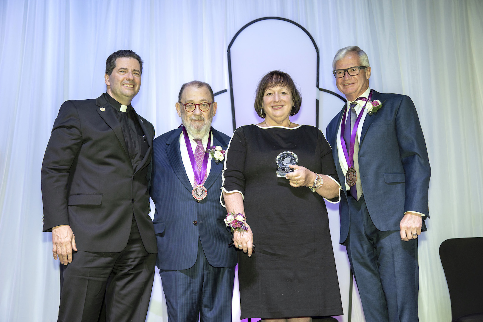 The Rev. James J. Maher, C.M., Niagara University president, with President's Dinner honorees Jonathan A. Dandes (Caritas Medal), president, Rich Baseball Operations; Kathleen A. Granchelli (St. Vincent de Paul Award), CEO, YWCA of the Niagara Frontier; and Robert B. Engel, (Medal of Honor), CEO and managing director, BLT Advisory Services LLC/retired president and CEO, CoBank, ACB.