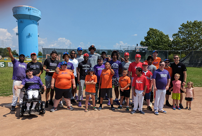 Members of Niagara University's Purple Eagle men's basketball team, coaches and players from the Central Amherst Little League's Challenger Division enjoyed a day of friendship and fun at the ballpark. (NU photo)