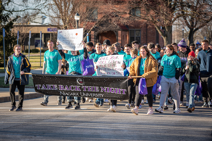 Students march across the Niagara University campus to `Take Back the Night.`
