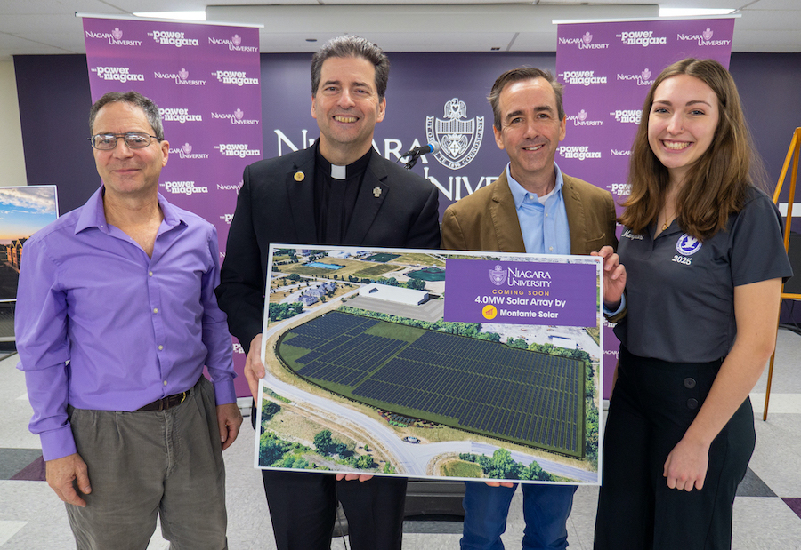 Dr. Mark Gallo, professor of biology; Rev. James J. Maher, C.M., Niagara University president; Daniel Montante, co-founder and president, Montante Solar; and Bethany Mangioni, Class of 2025, environmental science major, at the announcement of the construction of a 17-acre solar array on the university's Lewiston campus. (NU photo)