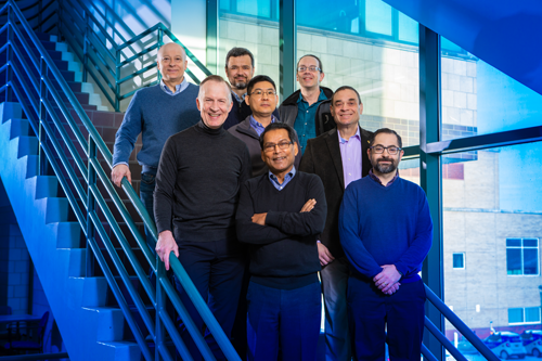 University at Buffalo researchers from multiple departments will play a key role in the new $7.5 million project. Bottom row, from left: Paras Prasad, principal investigator, and Luis Velarde. Middle row, from left: Jonathan Bird, co-principal investigator, Hao Zeng and Mark Swihart. Top row, from left: Andrey Kuzmin, Vasili Perebeinos and Alexander Baev. (Photo credit: Douglas Levere / University at Buffalo)