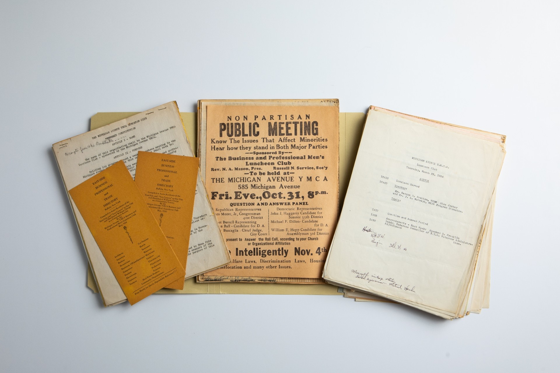 Old records from the Michigan Avenue Y.M.C.A. in Buffalo include items such as an East Side Business Professional and Trade Directory, a flyer for a public meeting with political candidates, and a luncheon club agenda. The items are part of a collection preserved by Lillian S. Williams, who partnered with the Y.M.C.A branch years ago to house its records at the University Archives, University at Buffalo, the State University of New York. Williams was first vice-president of the Afro-American Historical Association of the Niagara Frontier at the time she collected the items as part of the association's initiative to preserve records pertaining to Buffalo's African American community. (Credit: Douglas Levere / University at Buffalo)