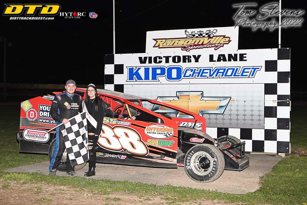 Ryan Susice earned the 358 Modified pole Friday night during `Test, Tune, and Time.` With Susice is Miss Ransomville Kelli-Lynn Wilkesmore (Photo by Tom Stevens)