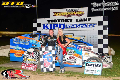 Miss Ransomville Mariah Reilly joins Erick Rudolph in victory lane. (Photo by Tom Stevens)