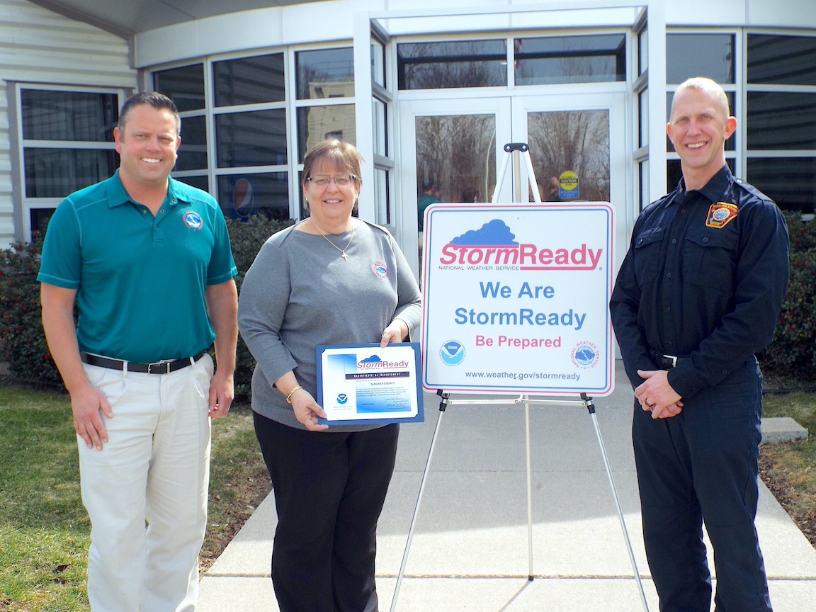 Pictured, from left to right: Michael Fries, warning coordination meteorologist and Judy Levan, meteorologist in charge, from National Weather Service Buffalo present the `StormReady` designation to Niagara County Director of Emergency Services Jonathan Schultz.