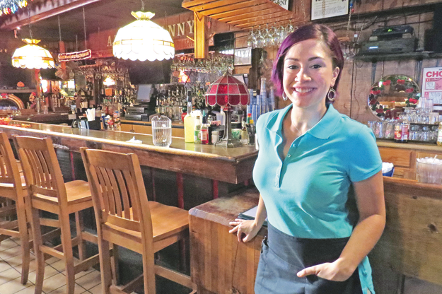 Diana DeGarmo stands in front of the Apple Granny Restaurant bar. The Village of Lewiston eatery is one of the local spots featured in `Morning Sun.`