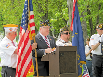 Veterans of Foreign Wars Downriver Post 7487 member Mike Roemer leads a past Memorial Day ceremony inside Academy Park. After a year off, the Lewiston event will return in 2016.
