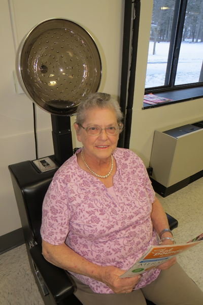 Twila Long sits inside the Mount View Assisted Living salon.