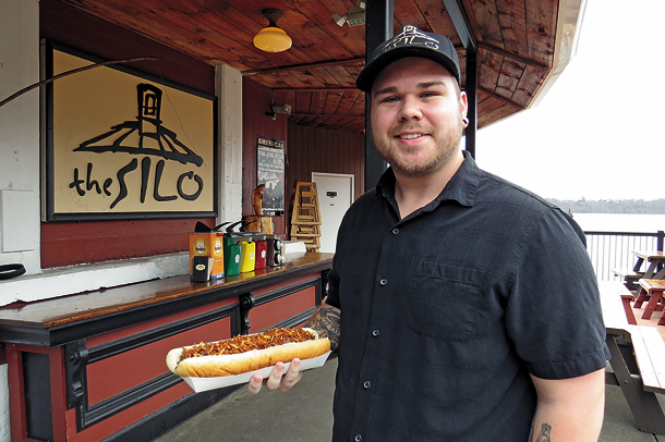 The Silo Restaurant is now offering some open days/times leading up to its official May opening. Pictured, The Silo's Dave Hatch holds a massive foot-long `Haystack` sandwich. (Photo by Joshua Maloni)