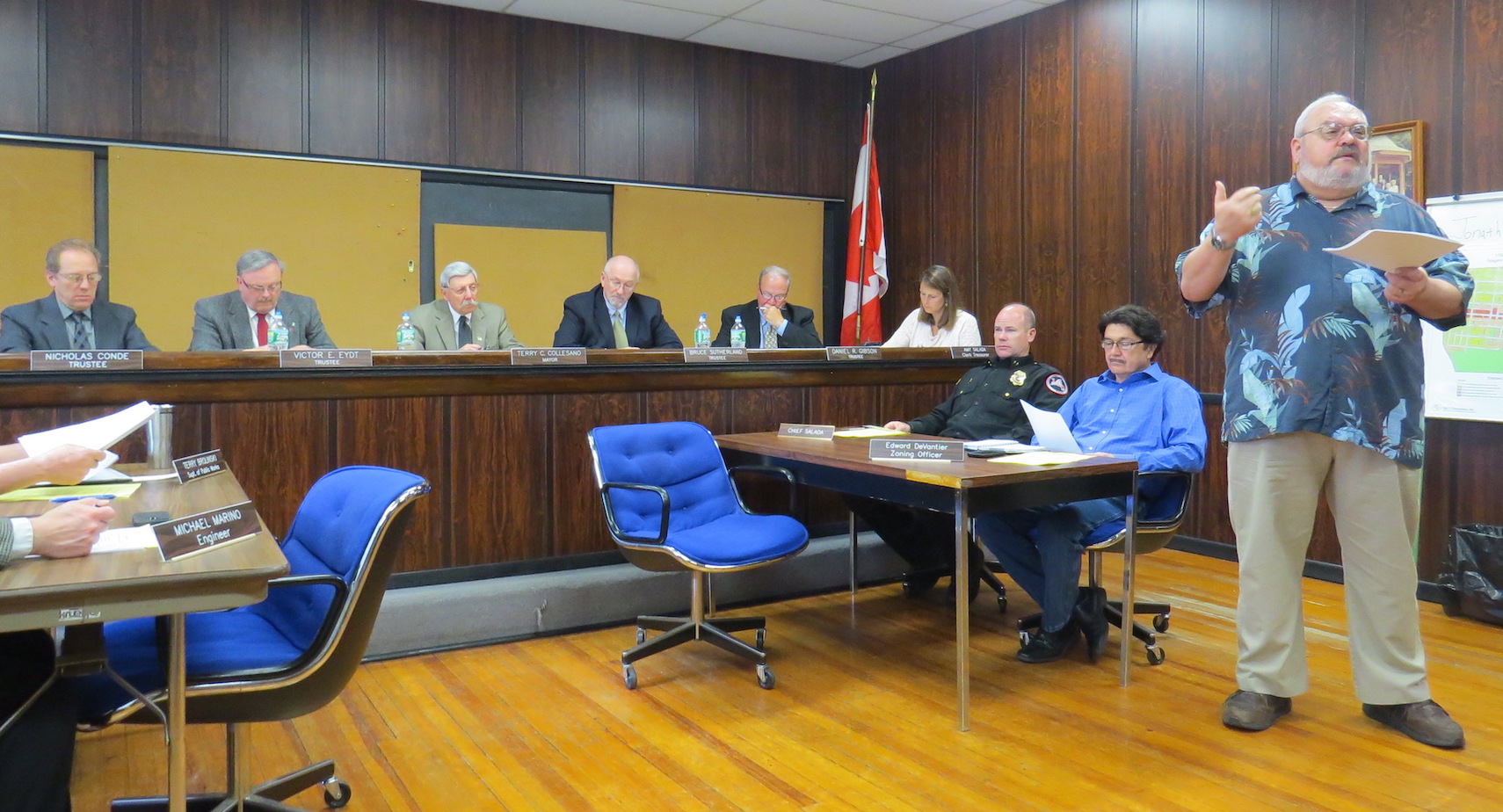 Village of Lewiston Deputy Treasurer Edward Walker discusses the fiscal year 2015-16 budget as trustees look on.