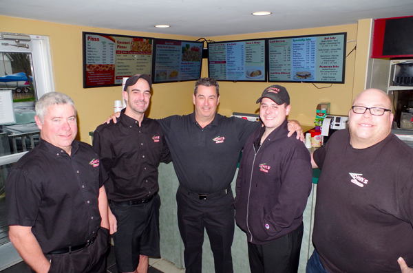 The team at John's Pizza & Subs is celebrating 35 years in business. From left: owner Gene Mongan, Jason Raepple (manager of the Delaware John's), owner Kurt Raepple, Alex Rumsey (manager of the Grand Island John's) and Joe Gnacinski (assistant manager of the Niagara Falls Boulevard John's). (Photo by Larry Austin)