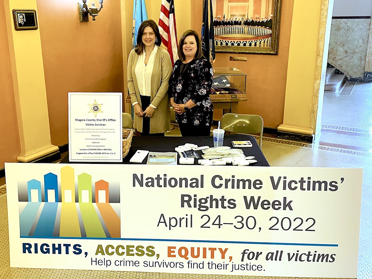 Pictured, from left: Niagara County Victim Services Coordinator Stacy Suess and Crime Victim Advocate Kelly Bird are shown in front of their display in the Niagara County Courthouse. (Submitted photo)