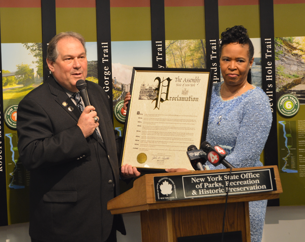 Niagara County Assemblyman John Ceretto presents a proclamation from the New York State Assembly to Renae Kimble, program coordinator of the Cancer Services Program of Niagara County.