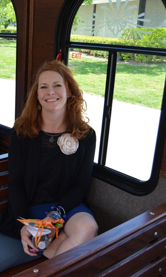 Sara Capen, Discover Niagara Shuttle project manager and executive director of the Niagara Falls National Heritage Area, enjoys a ride on the shuttle.