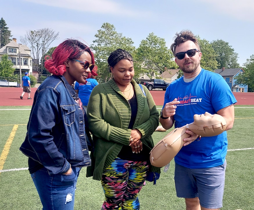 From left, Brianna Kirkland and Tasha Taylor listen to CPR Instructor Matt Bailey during the Hands-Only CPR training on Saturday, June 10, at the Johnnie B. Wiley Sports Pavilion in Buffalo. The training was made possible by a collaboration between the American Heart Association and the Buffalo Bills. The events were supported by Highmark Blue Cross Blue Shield of WNY. The American Heart Association and the Bills will continue community trainings.