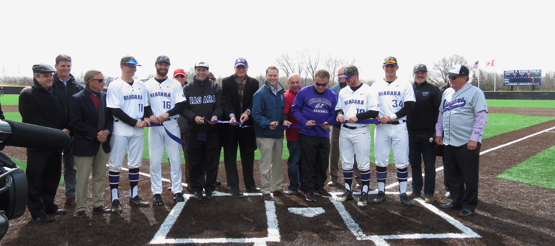 Representatives cut the ribbon to the new John P. Bobo baseball field at Niagara University. (All photos by David Yarger)