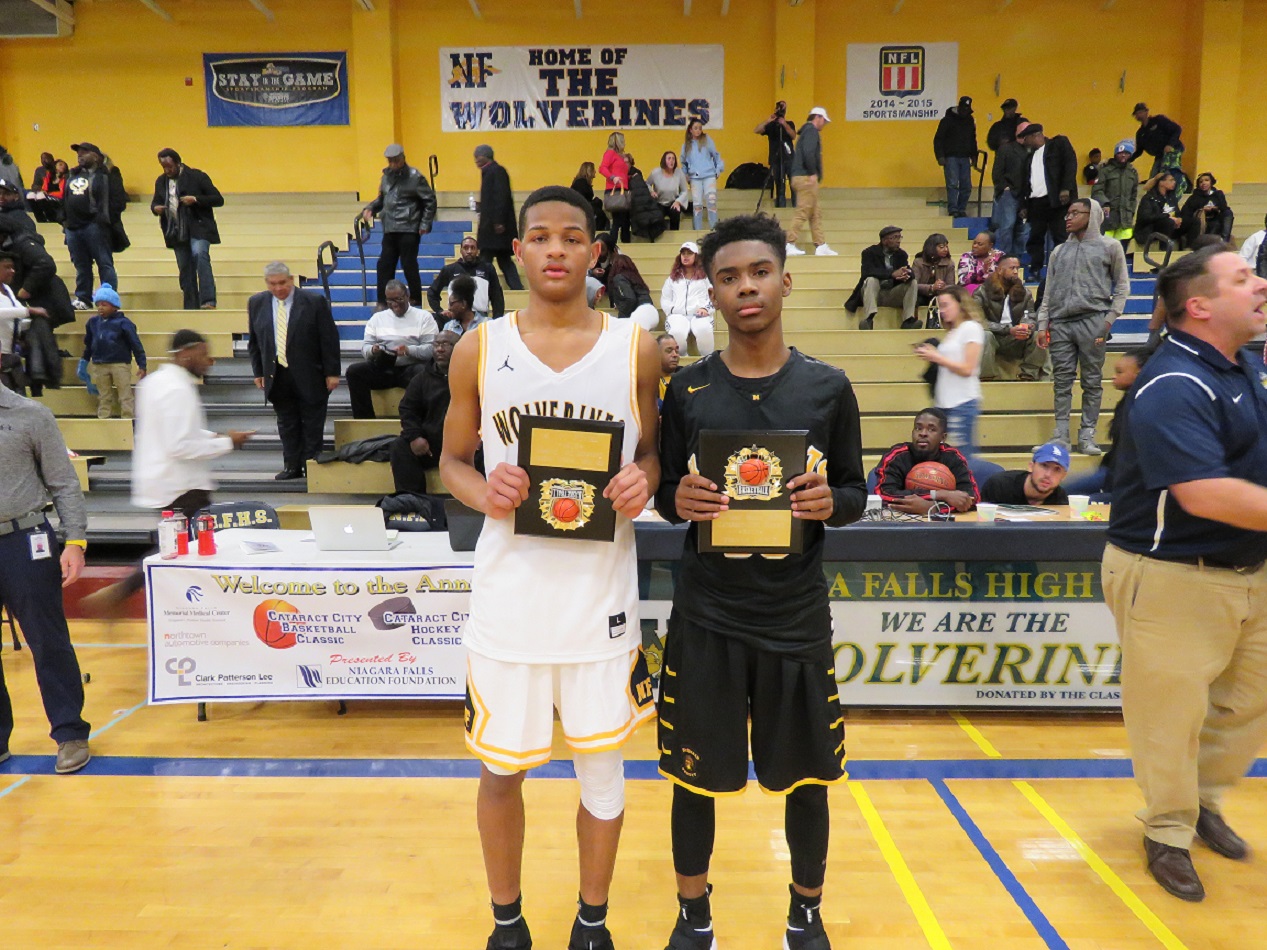 Niagara Falls game MVP Roddy Gayle stands next to McQuaid Jesuit's game MVP Kobe Long. Both were presented plaques by Niagara Falls Athletic Director Joe Contento following the game. (Photo by David Yarger)
