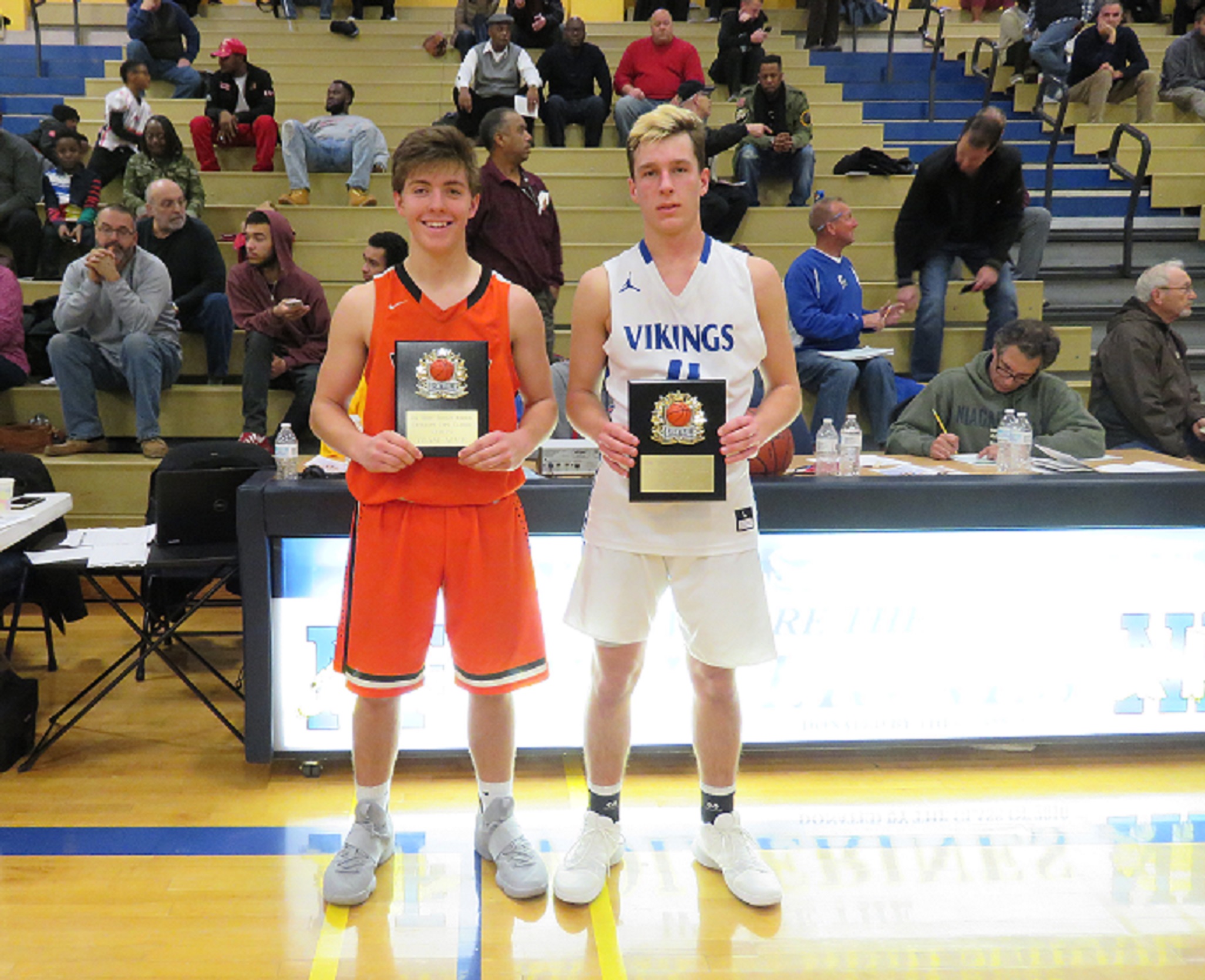 Game MVP's from Saturday night's Grand Island-Wilson game. Left to right: Nate Fox of Wilson, and Cam Sionko of Grand Island stand with their winning plaques. (Photo by David Yarger)