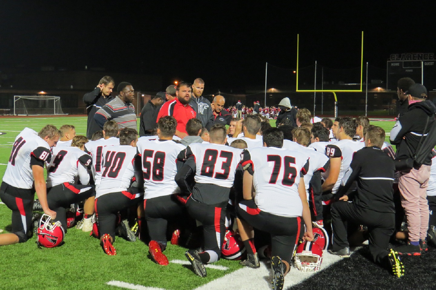 Coach Russ Nixon addresses his team following the loss at Clarence. 